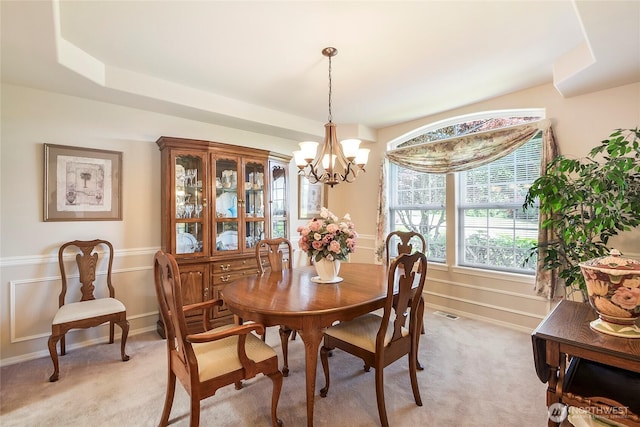 418 158th Pl NW, Arlington, WA 98223 - dining space featuring a chandelier, light carpet, a decorative wall, and a wainscoted wall