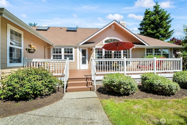 418 158th Pl NW, Arlington, WA 98223 - ranch-style home with a wooden deck, a shingled roof, and a chimney