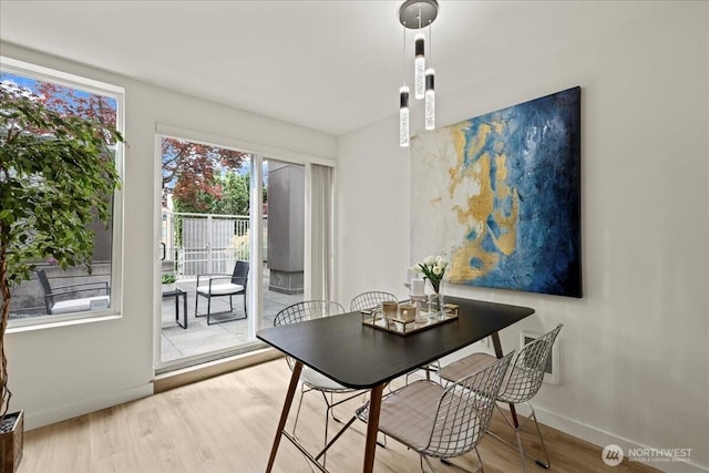 4343 Roosevelt Way NE Unit 102, Seattle, WA 98105 - dining area with baseboards and wood finished floors