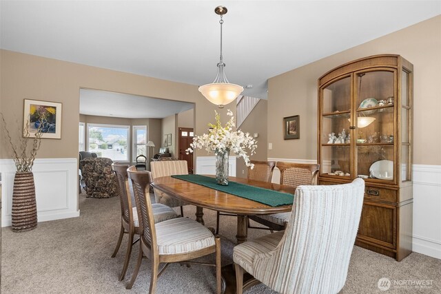 16520 136th Ave E, Puyallup, WA 98374 - dining area with light colored carpet, wainscoting, and a decorative wall