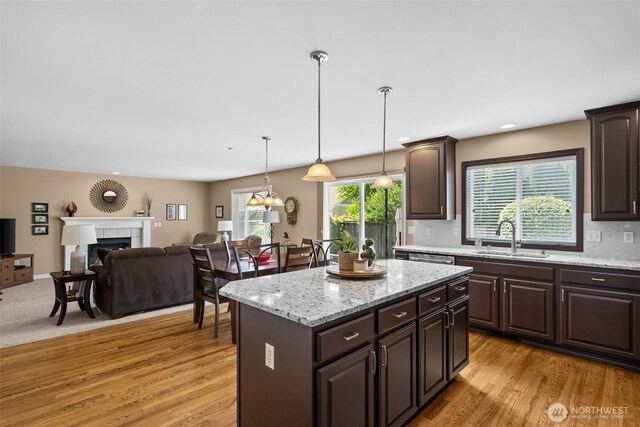 16520 136th Ave E, Puyallup, WA 98374 - kitchen with a sink, dark brown cabinetry, and light wood-type flooring