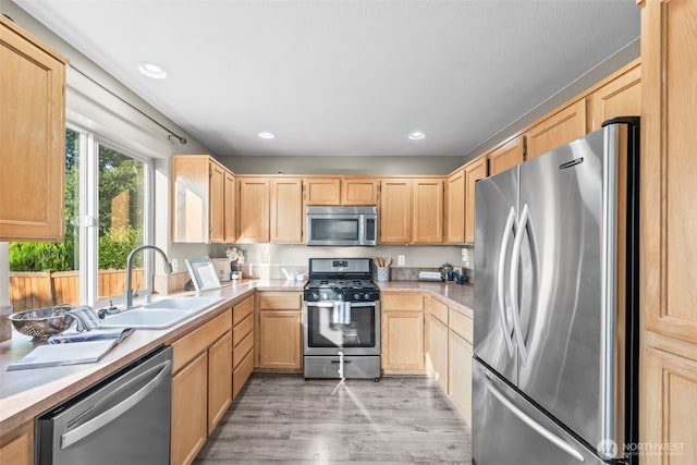 15235 105th Ave SE, Yelm, WA 98597 - kitchen featuring stainless steel appliances, light brown cabinets, light wood finished floors, light countertops, and recessed lighting