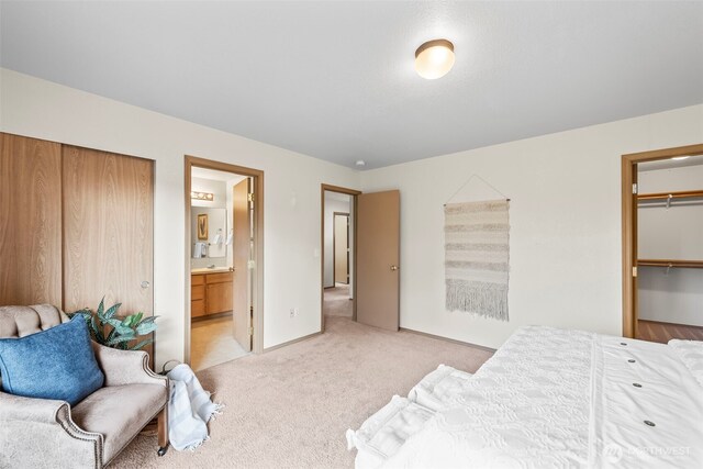 15235 105th Ave SE, Yelm, WA 98597 - bedroom featuring light colored carpet and ensuite bathroom
