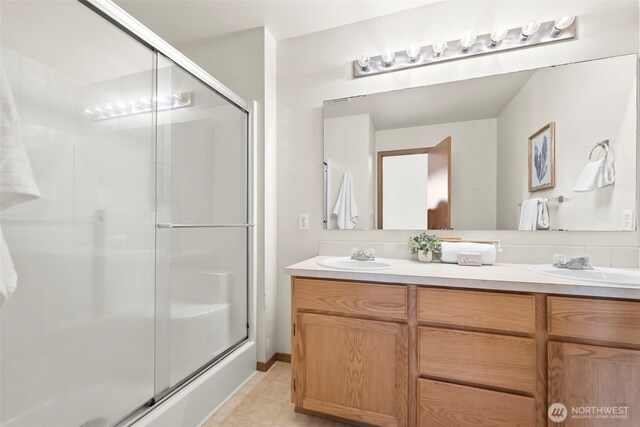 15235 105th Ave SE, Yelm, WA 98597 - full bath featuring double vanity, an enclosed shower, and tile patterned floors