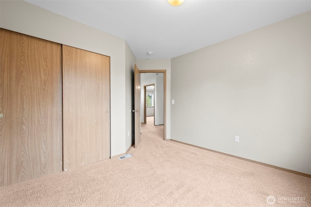 15235 105th Ave SE, Yelm, WA 98597 - unfurnished bedroom featuring light colored carpet and a closet