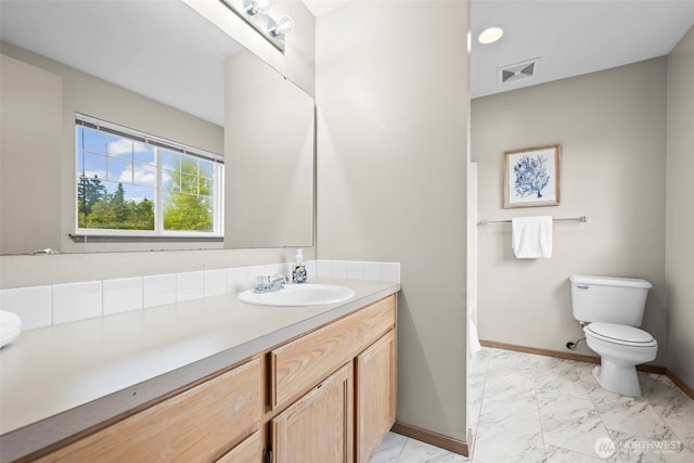 15235 105th Ave SE, Yelm, WA 98597 - bathroom featuring vanity and marble look tiles