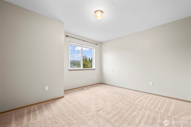 15235 105th Ave SE, Yelm, WA 98597 - empty room featuring carpet and baseboards