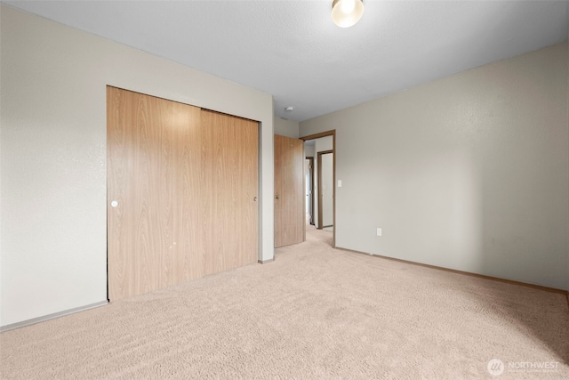15235 105th Ave SE, Yelm, WA 98597 - unfurnished bedroom featuring light carpet and a closet