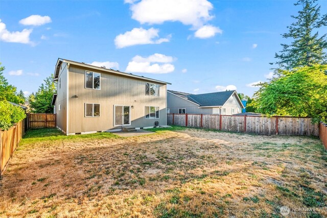 15235 105th Ave SE, Yelm, WA 98597 - rear view of property with a fenced backyard and a patio area