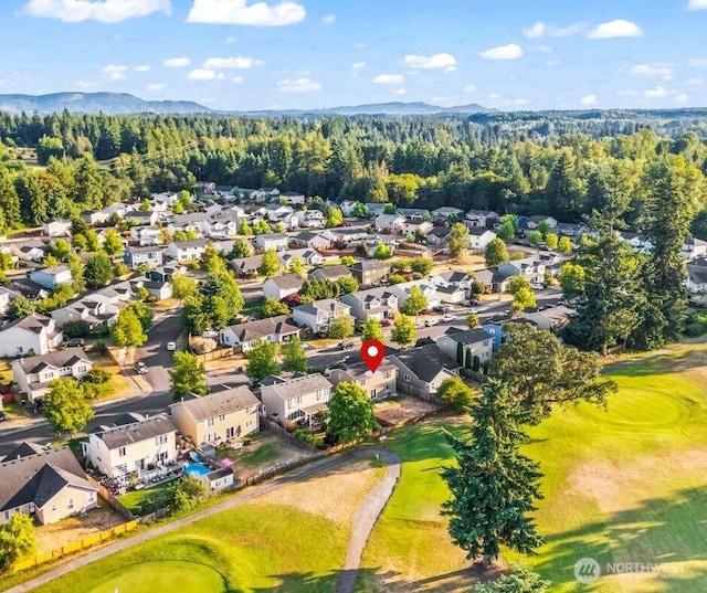 15235 105th Ave SE, Yelm, WA 98597 - aerial perspective of suburban area with a golf club and mountains