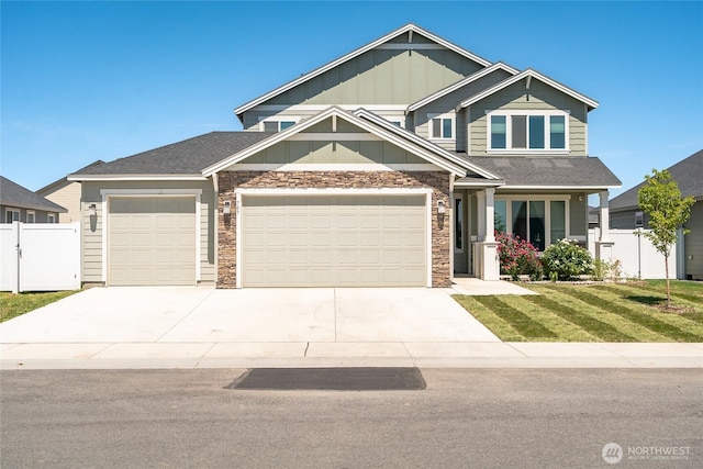 707 I St NE, Quincy, WA 98848 - craftsman inspired home with board and batten siding, stone siding, an attached garage, and driveway