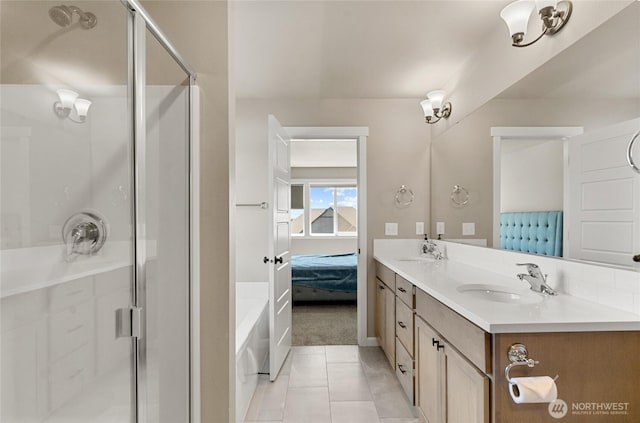 707 I St NE, Quincy, WA 98848 - bathroom featuring ensuite bathroom, a stall shower, double vanity, a bath, and tile patterned floors