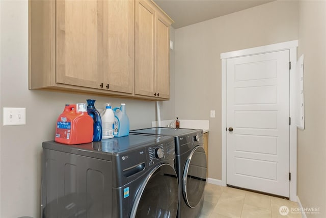 707 I St NE, Quincy, WA 98848 - laundry area with separate washer and dryer, cabinet space, baseboards, and light tile patterned floors