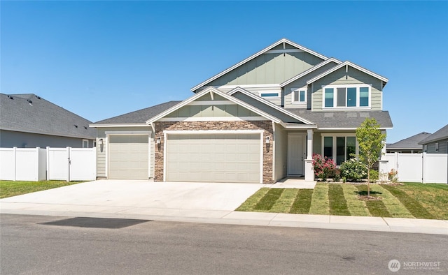 707 I St NE, Quincy, WA 98848 - craftsman-style home featuring board and batten siding, concrete driveway, and an attached garage