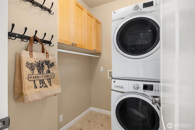 19799 NE Ash Crest Loop, Poulsbo, WA 98370 - washroom with stacked washer / dryer, cabinet space, and baseboards
