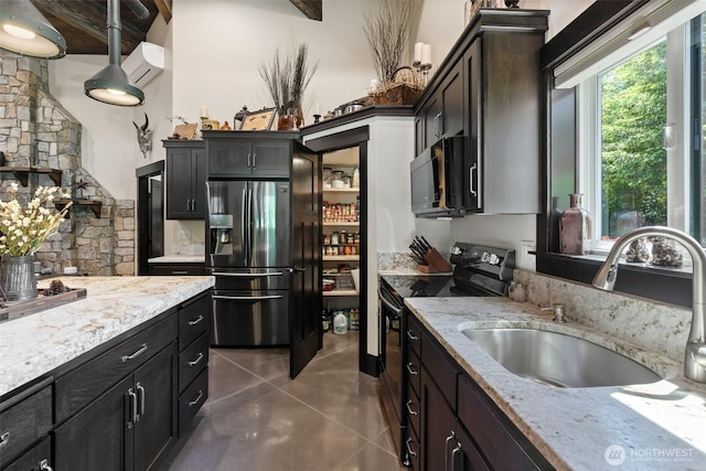 335 Brown Rd, Chehalis, WA 98532 - kitchen featuring black appliances, a sink, and light stone countertops