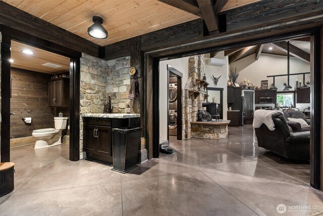 335 Brown Rd, Chehalis, WA 98532 - ensuite bathroom with vanity, toilet, finished concrete flooring, and wooden ceiling with exposed beams