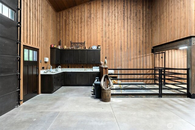 335 Brown Rd, Chehalis, WA 98532 - misc room featuring wooden walls, concrete flooring, a sink, vaulted ceiling, and wood ceiling