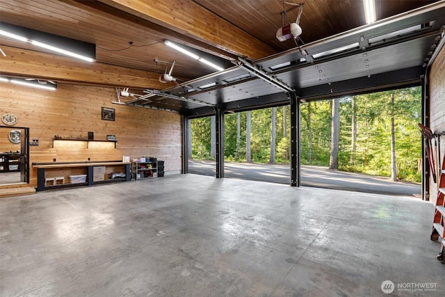335 Brown Rd, Chehalis, WA 98532 - garage featuring wooden walls and a garage door opener