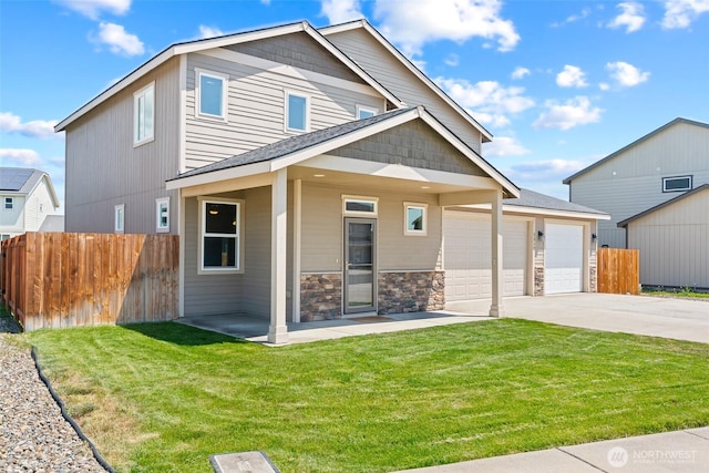 2212 N Creeksedge Way, Ellensburg, WA 98926 - view of front of property featuring driveway, a garage, stone siding, and a shingled roof