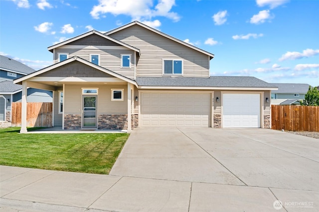 2212 N Creeksedge Way, Ellensburg, WA 98926 - view of front facade featuring driveway, stone siding, and a garage