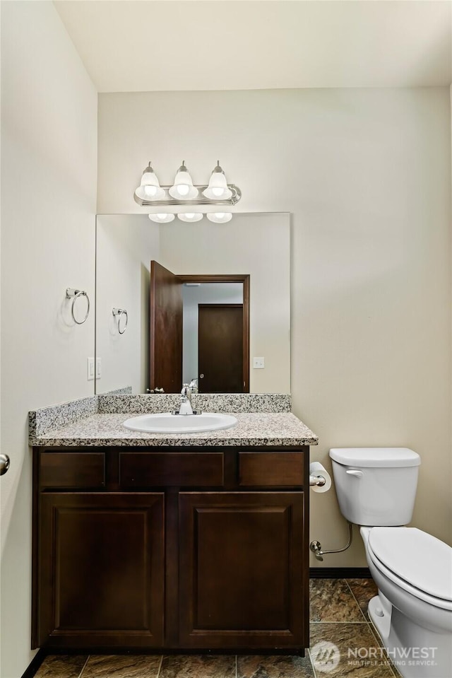 2212 N Creeksedge Way, Ellensburg, WA 98926 - bathroom with toilet, vanity, and baseboards