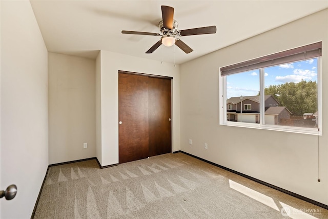 2212 N Creeksedge Way, Ellensburg, WA 98926 - unfurnished bedroom with carpet flooring, baseboards, a closet, and a ceiling fan