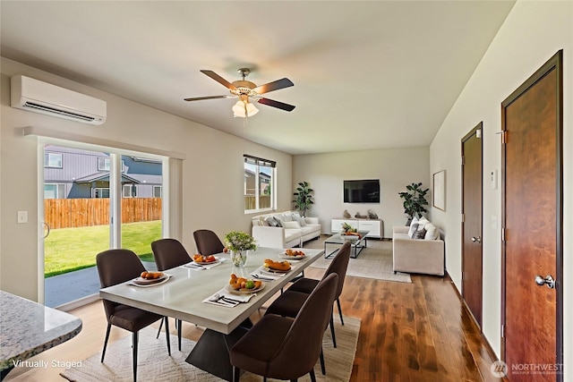 2212 N Creeksedge Way, Ellensburg, WA 98926 - dining space with a wall mounted air conditioner, wood finished floors, and ceiling fan