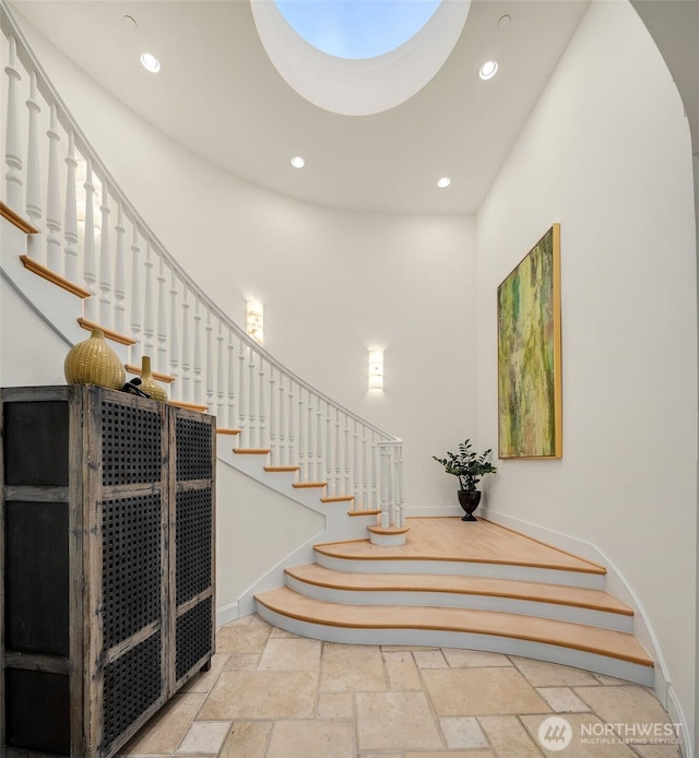 7 10th Ave, Kirkland, WA 98033 - staircase featuring stone tile floors, baseboards, and recessed lighting
