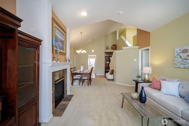1110 63rd St E Unit 101, Auburn, WA 98092 - living room featuring high vaulted ceiling, a chandelier, light colored carpet, baseboards, and a tiled fireplace