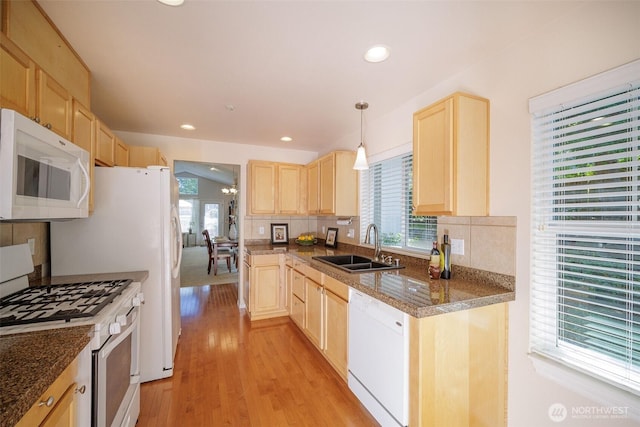 1110 63rd St E Unit 101, Auburn, WA 98092 - kitchen featuring white appliances, light brown cabinetry, a sink, healthy amount of natural light, and recessed lighting