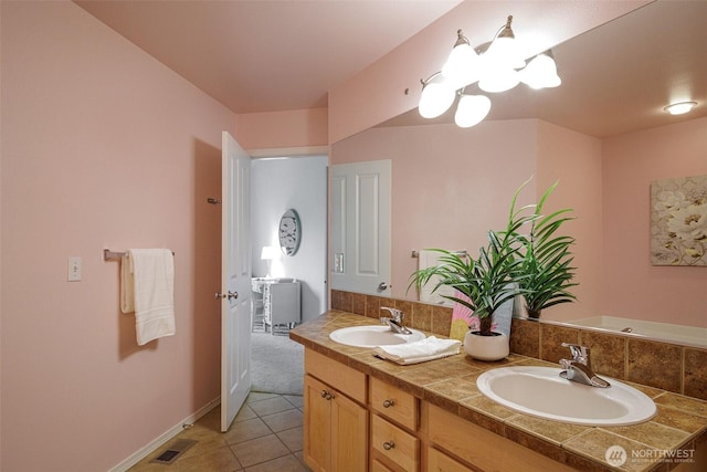 1110 63rd St E Unit 101, Auburn, WA 98092 - full bath featuring double vanity, tile patterned floors, a chandelier, and baseboards