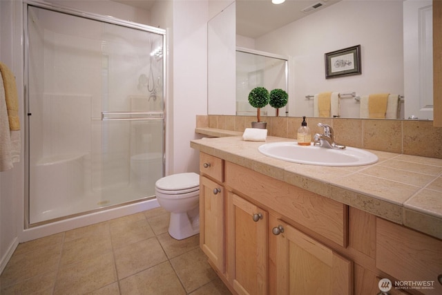 1110 63rd St E Unit 101, Auburn, WA 98092 - bathroom featuring toilet, vanity, and a stall shower