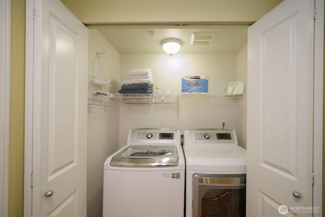 1110 63rd St E Unit 101, Auburn, WA 98092 - laundry area featuring separate washer and dryer