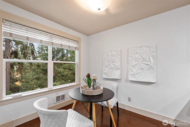 22910 90th Ave W Unit E406, Edmonds, WA 98026 - dining room with healthy amount of natural light, dark wood-type flooring, and baseboards