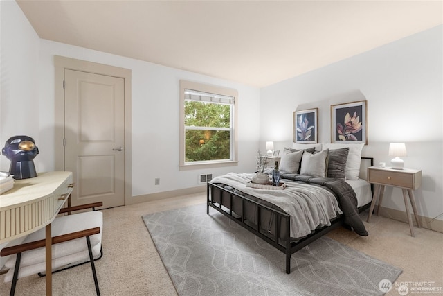 22910 90th Ave W Unit E406, Edmonds, WA 98026 - bedroom featuring light carpet and baseboards