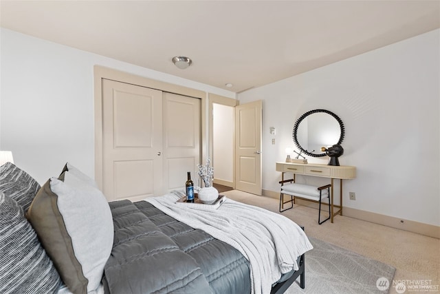 22910 90th Ave W Unit E406, Edmonds, WA 98026 - bedroom with carpet flooring, a closet, and baseboards