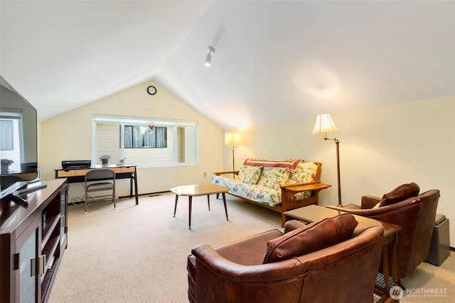 924 S 245th Pl, Des Moines, WA 98198 - living area with light carpet, a desk, vaulted ceiling, and plenty of natural light