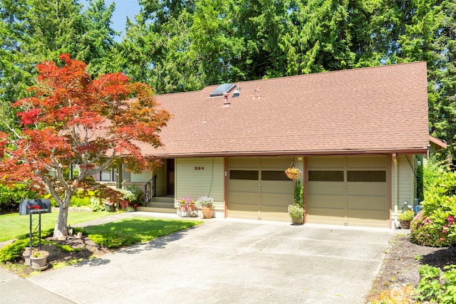 924 S 245th Pl, Des Moines, WA 98198 - view of front of home featuring driveway, roof with shingles, a garage, and a front lawn