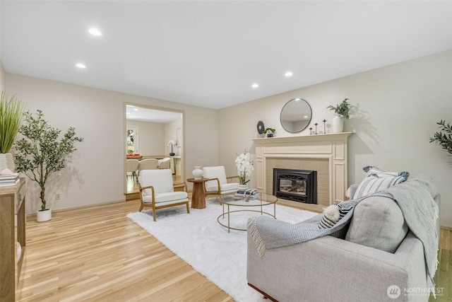 11750 NE 36th Pl, Bellevue, WA 98005 - living area featuring light wood-style floors, a brick fireplace, and recessed lighting