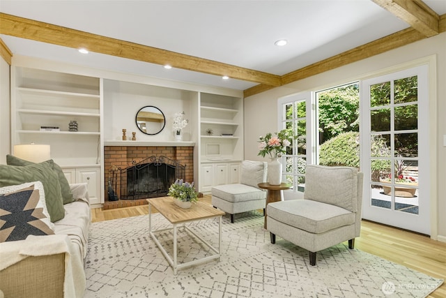 11750 NE 36th Pl, Bellevue, WA 98005 - living area with beam ceiling, wood finished floors, a brick fireplace, built in features, and recessed lighting