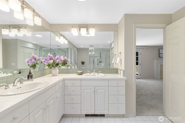 11750 NE 36th Pl, Bellevue, WA 98005 - full bathroom with a shower stall, double vanity, decorative backsplash, and tile patterned floors