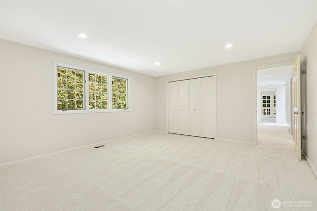 11750 NE 36th Pl, Bellevue, WA 98005 - unfurnished bedroom featuring recessed lighting, light colored carpet, and a closet
