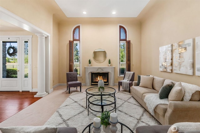 7212 Canterwood Dr SE, Olympia, WA 98513 - living room featuring decorative columns, a premium fireplace, wood finished floors, and recessed lighting