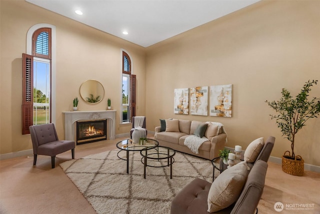 7212 Canterwood Dr SE, Olympia, WA 98513 - living room with carpet flooring, healthy amount of natural light, a premium fireplace, recessed lighting, and a towering ceiling