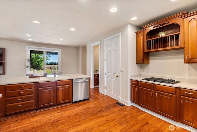 7212 Canterwood Dr SE, Olympia, WA 98513 - kitchen with dishwasher, black gas cooktop, light wood-style flooring, light countertops, and recessed lighting