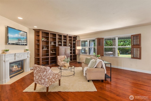 7212 Canterwood Dr SE, Olympia, WA 98513 - living room with a fireplace with flush hearth, wood finished floors, and recessed lighting