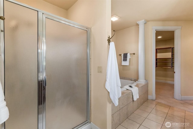 7212 Canterwood Dr SE, Olympia, WA 98513 - bathroom with tile patterned floors, a shower stall, and tiled bath