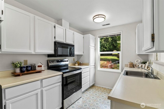 4152 Providence Point Dr SE Unit 207, Issaquah, WA 98029 - kitchen with stainless steel electric range, black microwave, a sink, and white cabinets