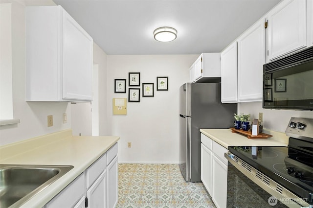4152 Providence Point Dr SE Unit 207, Issaquah, WA 98029 - kitchen featuring electric stove, black microwave, white cabinets, light countertops, and baseboards